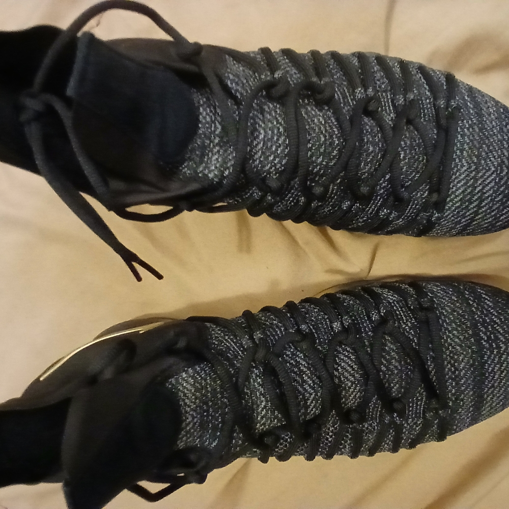 Kevin Durant black/gold Nike shoes.